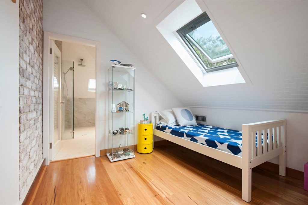 Photo of an attic converted into a kid's bedroom and bathroom
