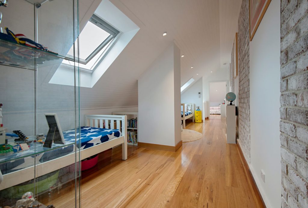 Photo of an attic converted into a kid's bedroom with skylight